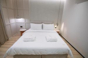 Postel nebo postele na pokoji v ubytování Boulevard Boutique Aparthotel