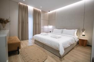 เตียงในห้องที่ Boulevard Boutique Aparthotel