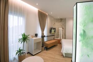 Postel nebo postele na pokoji v ubytování Boulevard Boutique Aparthotel