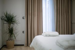 Postel nebo postele na pokoji v ubytování Boulevard Boutique Aparthotel