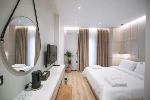TV a/nebo společenská místnost v ubytování Boulevard Boutique Aparthotel + 37 fotografií