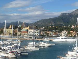 a bunch of boats are docked in a harbor at Le Vele Residence Sailing Boat in Loano