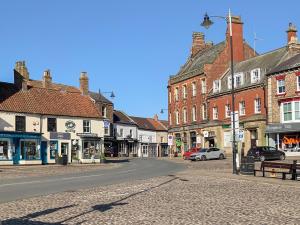 an empty street in a town with buildings at Number 15 in Thirsk