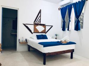Postel nebo postele na pokoji v ubytování Casa Universo Holbox