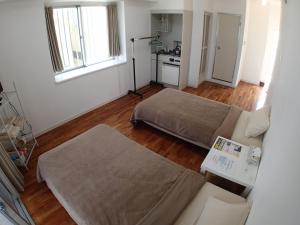 a living room with a bed and a couch at Lagoon Palace in Nogunukaniku