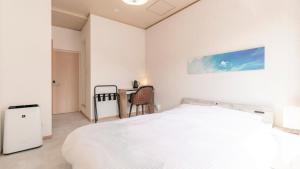 Voodi või voodid majutusasutuse VOYAN Resort Fujiyamanakako Gekkoso toas