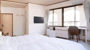 Voodi või voodid majutusasutuse VOYAN Resort Fujiyamanakako Gekkoso toas