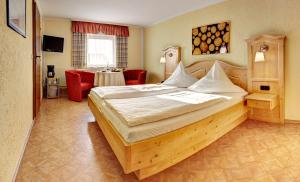 a bedroom with a large bed in a room at Gasthof Meindl in Arrach +67 photos