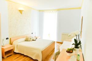 Кровать или кровати в номере Residenza Villa Maria