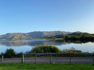 a view of a lake with mountains in the background at Loch Morar Private Suite in Mallaig