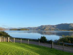 a view of a lake with mountains in the background at Loch Morar Private Suite in Mallaig
