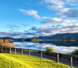a view of a lake with mountains in the background at Loch Morar Private Suite in Mallaig