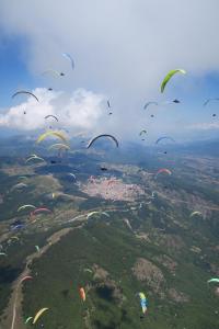 a bunch of kites are flying in the sky at Luxury Villa Medusa Temple in Kruševo