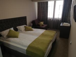 Postel nebo postele na pokoji v ubytování Hotel Ponti