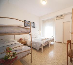 Voodi või voodid majutusasutuse Hotel Gemini toas