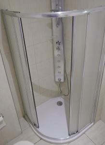a shower with a glass door in a bathroom at ALASSIO Trilocale a 50mt dal mare in Alassio +23 photos