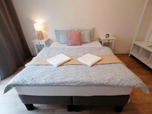 Postel nebo postele na pokoji v ubytování Prima Family Apartments