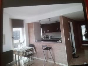 Kuchyň nebo kuchyňský kout v ubytování Albir Sunshine Apartments