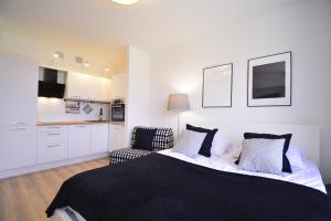 Posteľ alebo postele v izbe v ubytovaní Apartamenty Bryza-Matejki 1B-Parking