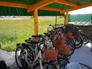 a group of bikes parked under a gazebo at Villa Roma Holidays in Jesolo