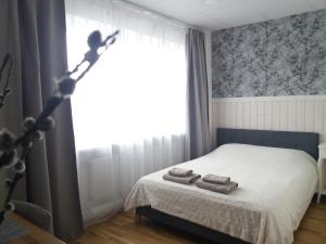 Postel nebo postele na pokoji v ubytování Nurmbergi Maja