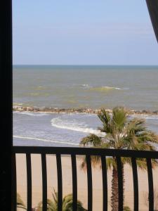 a view of the beach from a balcony at Hotel Canguro in San Benedetto del Tronto