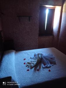 a bed with a pile of blood on it at Casa rural "Matela" in Prado