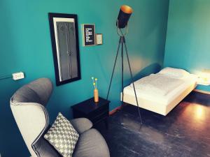 a bedroom with a bed and a lamp at Backpackers Luzern in Lucerne
