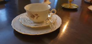 a tea cup and saucer on a table at Leopold Boutique Hotel in Östersund