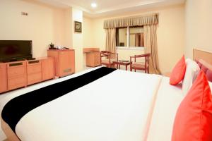 Krevet ili kreveti u jedinici u objektu Collection O 2521 Hotel The Vinayak