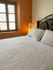 Letto o letti in una camera di Riad Jbara