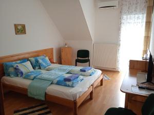 Katil atau katil-katil dalam bilik di Agria Wellness Guesthouse