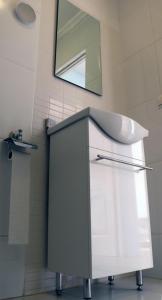 a bathroom with a sink and a mirror at La Cenia in Denia