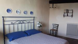 A bed or beds in a room at Residenza Monastero de' Medici
