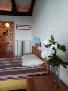 A bed or beds in a room at Residenza Monastero de' Medici