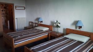 A bed or beds in a room at Residenza Monastero de' Medici