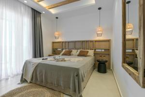 Sea & Olives Suites Hotel and Villas客房内的一张或多张床位