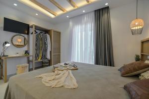 Sea & Olives Suites Hotel and Villas客房内的一张或多张床位