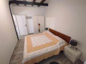 Postel nebo postele na pokoji v ubytování Apartments Bepi