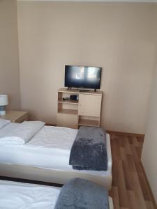 Posteľ alebo postele v izbe v ubytovaní Apartament na Wydmie Ustka