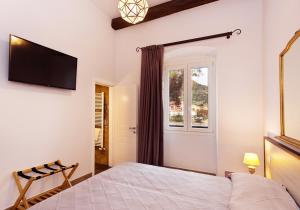 Katil atau katil-katil dalam bilik di Casa Porta Marina