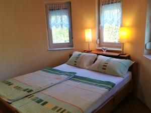 Postel nebo postele na pokoji v ubytování Apartman Mercédesz II.