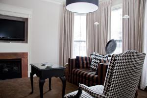 a living room with a couch and a chair and a table at Inn at St. Botolph in Boston