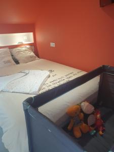 Postel nebo postele na pokoji v ubytování Le Fiege gîte cosy et confort