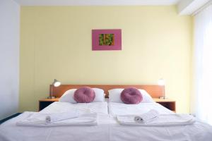 Postel nebo postele na pokoji v ubytování Art Hotel