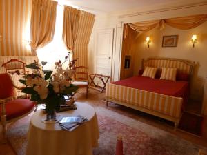 Ένα ή περισσότερα κρεβάτια σε δωμάτιο στο Domaine De Chatenay - Le Mans