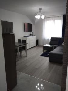 Χώρος καθιστικού στο APARTAMENT CENTRUM Węgorzewa +4 φωτογραφίες