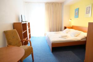 Posteľ alebo postele v izbe v ubytovaní Art Hotel