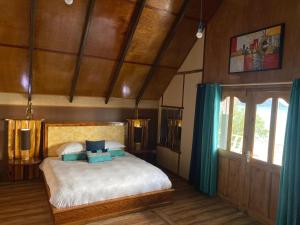 Ένα ή περισσότερα κρεβάτια σε δωμάτιο στο Mouggae Blues Villas