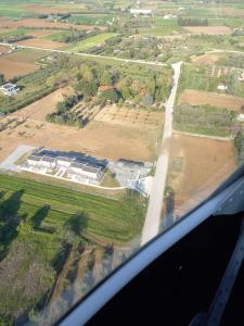 an aerial view of a field from an airplane at GERANI apartments in Órmos